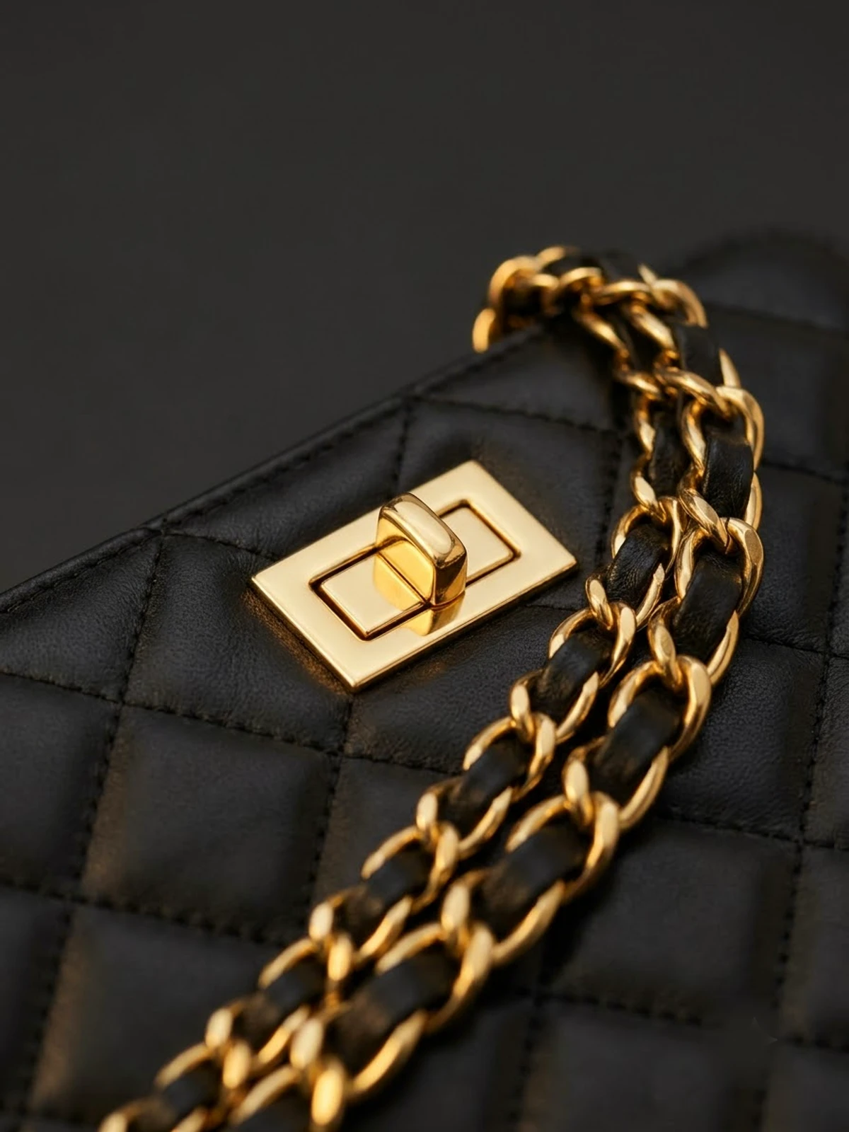 Chanel-style hardware macro — weight, plating and engraving.